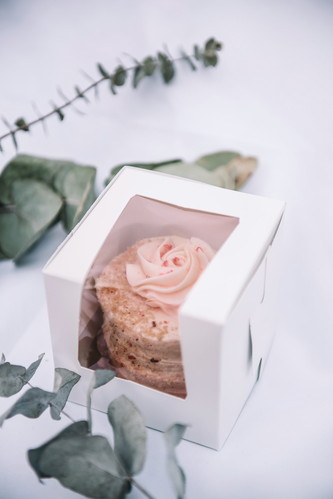 A mini cake presented in a white gift box